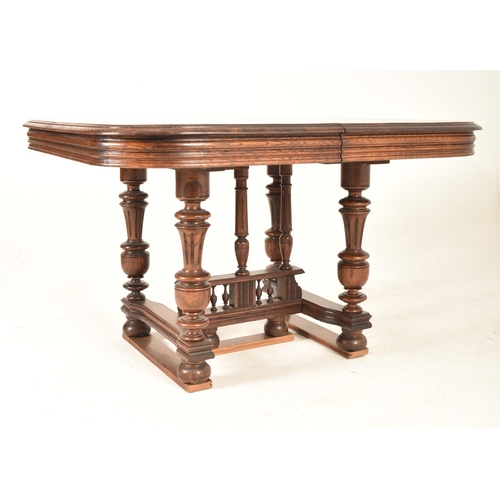 557 - A late 19th century French circa 1890 oak draw-leaf dining table in the Henry II style. The table of... 