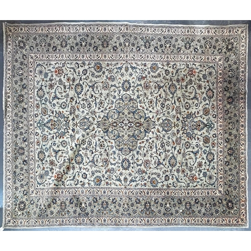 559 - An early 20th century Central Persian Islamic Kashan floor carpet rug. The rug having green tones gr... 