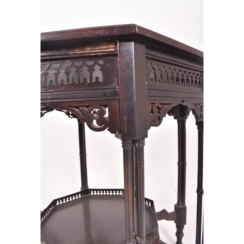 562 - A 19th century mahogany Chinese Chippendale style octagonal form centre table. The table having a pi... 