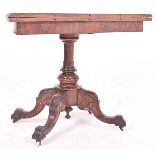 565 - A Victorian 19th century burr walnut demi-lune foldover card game table. The table having a chamfere... 