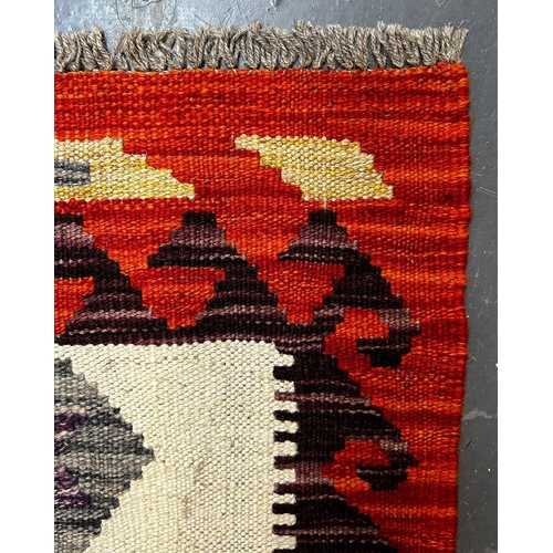 571 - A contemporary Anatolian Turkish Kilim floor carpet rug. The rug having a central panel with repeati... 