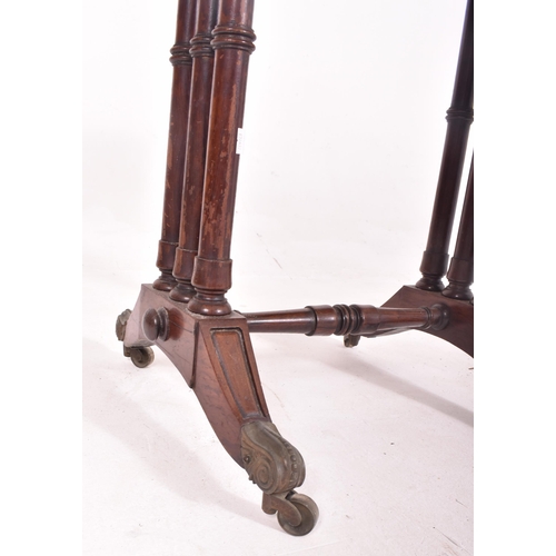 573 - A 19th century Victorian rosewood card / games table. The table having a fold over swivel top lined ... 