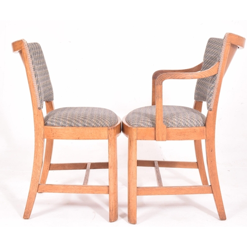 576 - Heals Of London - A 20th century Art Deco oak dining table and matching four chairs. The table havin... 