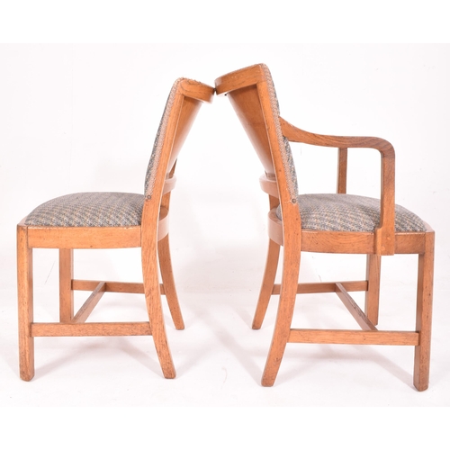 576 - Heals Of London - A 20th century Art Deco oak dining table and matching four chairs. The table havin... 