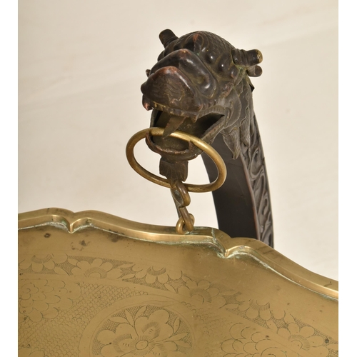 591 - A Republic period circular two tier brass tray-top folding table. The top of the tray in solid brass... 