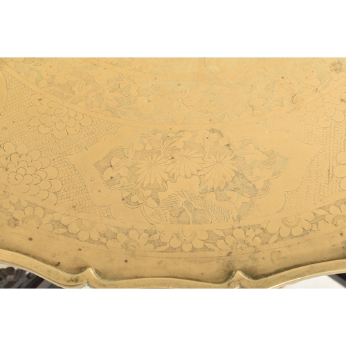 591 - A Republic period circular two tier brass tray-top folding table. The top of the tray in solid brass... 