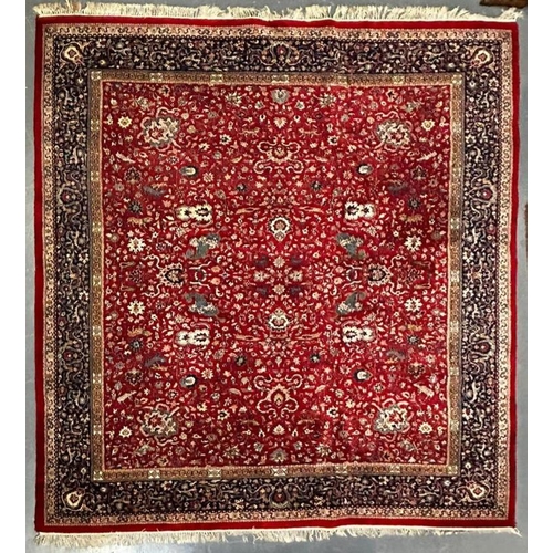 593 - A squared early 20th century Persian Islamic Kashan floor carpet rug. The rug having a central red g... 