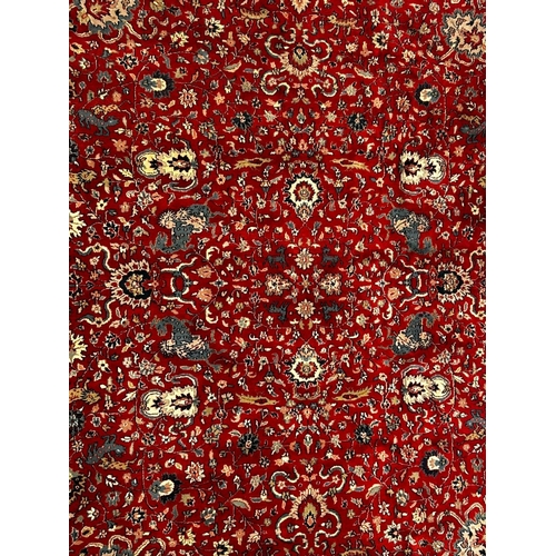 593 - A squared early 20th century Persian Islamic Kashan floor carpet rug. The rug having a central red g... 