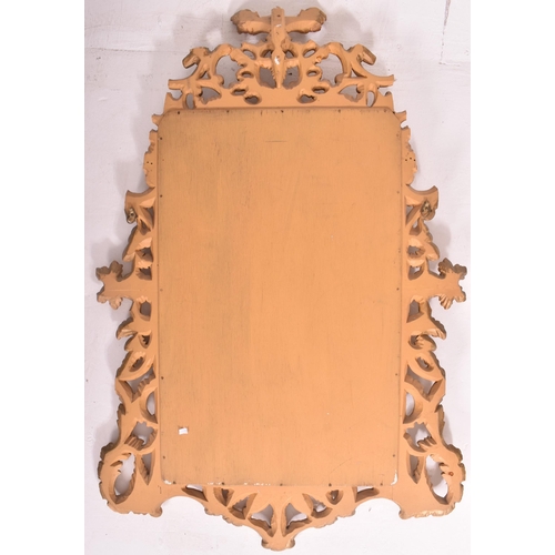 594 - A French inspired Rococo style 19th century giltwood mantle mirror. The mirror having an intricately... 