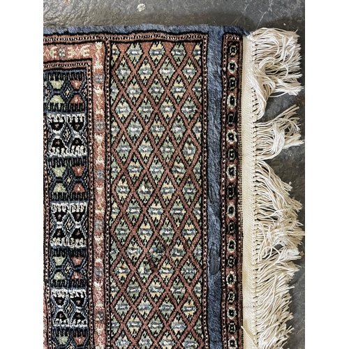 595 - A vintage late 20th century North West Persian Islamic hand knitted wool on silk floor runner rug. T... 