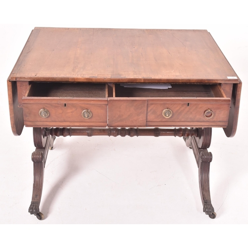 596 - A George III early 19th century mahogany & satinwood drop leaf sofa desk table. The table having a r... 