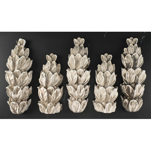 604 - A collection of five 20th century cast plaster architectural embellishments in the shape of acanthus... 