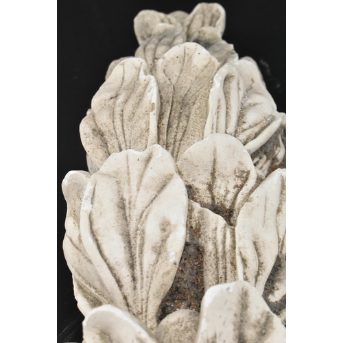 604 - A collection of five 20th century cast plaster architectural embellishments in the shape of acanthus... 