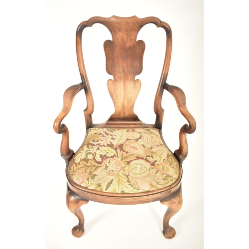 607 - A Queen Anne Revival 19th century carved walnut armchair. The chair having a pierced back rest with ... 