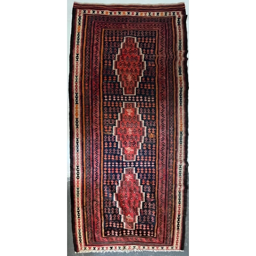 609 - A contemporary Persian Islamic Kilim floor carpet runner rug. The rug having a central panel with th... 