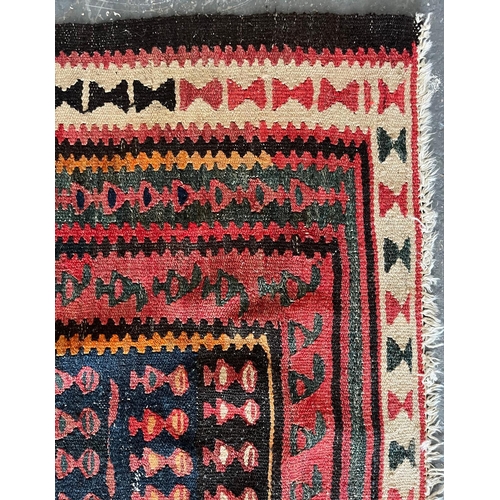 609 - A contemporary Persian Islamic Kilim floor carpet runner rug. The rug having a central panel with th... 