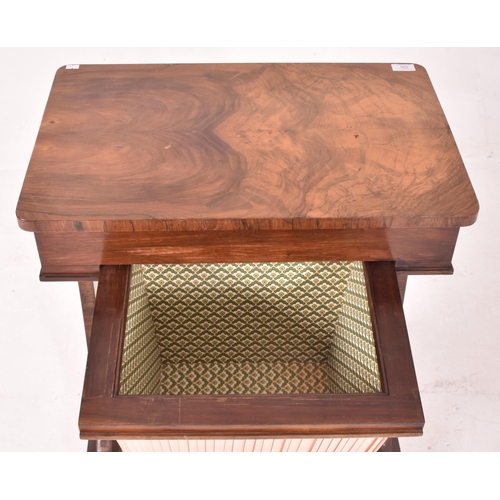 626 - An early 19th century flame mahogany rectangular sewing table. The table having a curved edge rectan... 