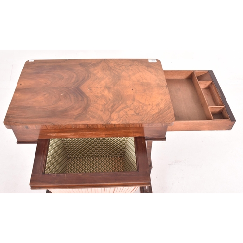 626 - An early 19th century flame mahogany rectangular sewing table. The table having a curved edge rectan... 