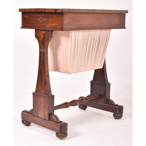 626 - An early 19th century flame mahogany rectangular sewing table. The table having a curved edge rectan... 