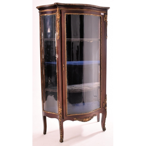 630 - A French Empire early 20th century serpentine fronted mahogany cabinet in the manner of Vernis Marti... 