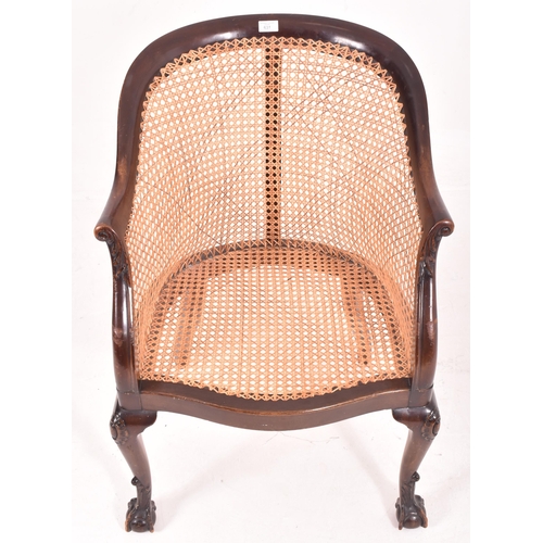 631 - Wylie & Lochhead Ltd. - an early 20th century Edwardian wicker and mahogany bergere library armchair... 