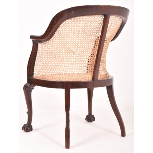 631 - Wylie & Lochhead Ltd. - an early 20th century Edwardian wicker and mahogany bergere library armchair... 