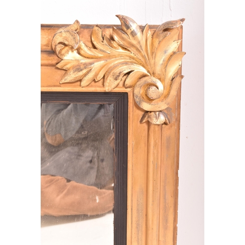 633 - A Regency early 19th century gilt wood three piers over mantel mirror. The mirror having a scrolled ... 