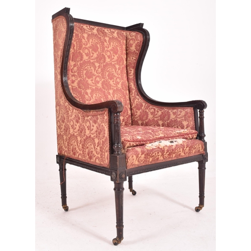 639 - A late 19th century Victorian mahogany framed wingback armchair / porterts hall chair. The chair hav... 