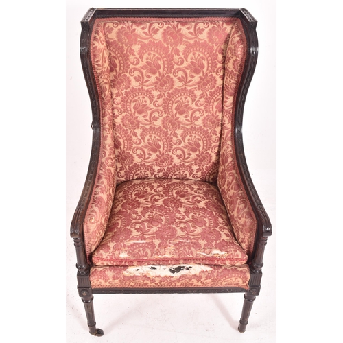 639 - A late 19th century Victorian mahogany framed wingback armchair / porterts hall chair. The chair hav... 