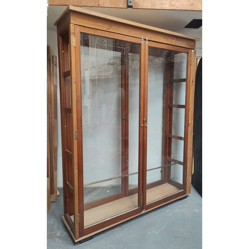 398 - A large 20th century pine wood & mahogany haberdashery shop display cabinet. The cabinet having a pe... 