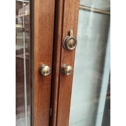 398 - A large 20th century pine wood & mahogany haberdashery shop display cabinet. The cabinet having a pe... 