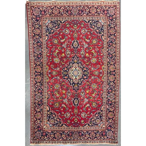 529 - A 20th century Central Persian Islamic Kashan floor carpet rug. The rug having central medallions in... 