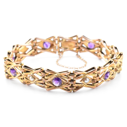 17 - An early 20th century pearl & amethyst gate link bracelet. The Edwardian bracelet set with alternati... 