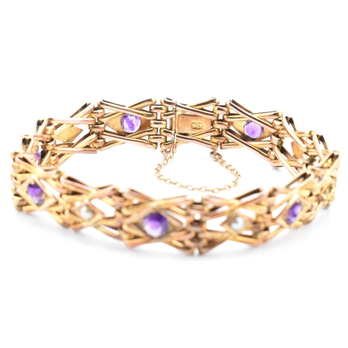 17 - An early 20th century pearl & amethyst gate link bracelet. The Edwardian bracelet set with alternati... 