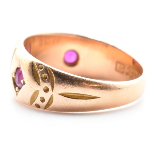 21 - A 19th century Victorian 15ct gold and gem set ring. The ring set with two rubies and four well worn... 