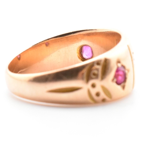 21 - A 19th century Victorian 15ct gold and gem set ring. The ring set with two rubies and four well worn... 