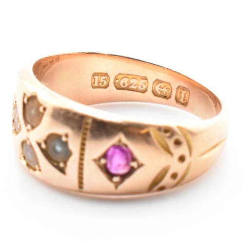 21 - A 19th century Victorian 15ct gold and gem set ring. The ring set with two rubies and four well worn... 