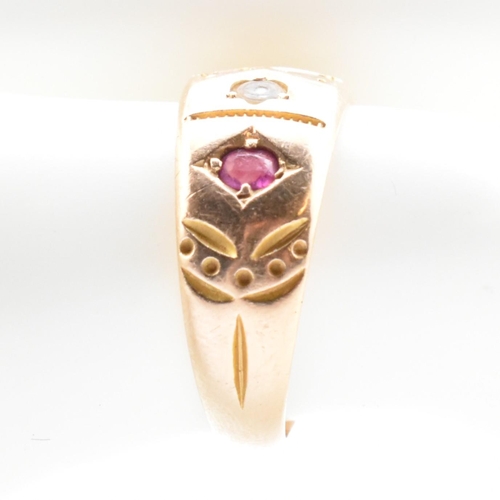 21 - A 19th century Victorian 15ct gold and gem set ring. The ring set with two rubies and four well worn... 