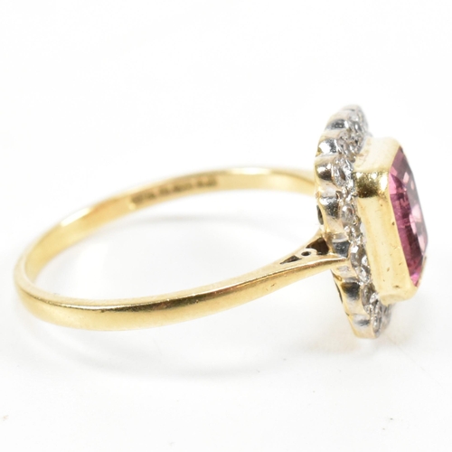 23 - A hallmarked 18ct gold pink tourmaline and diamond halo ring. The ring set with a central emerald cu... 