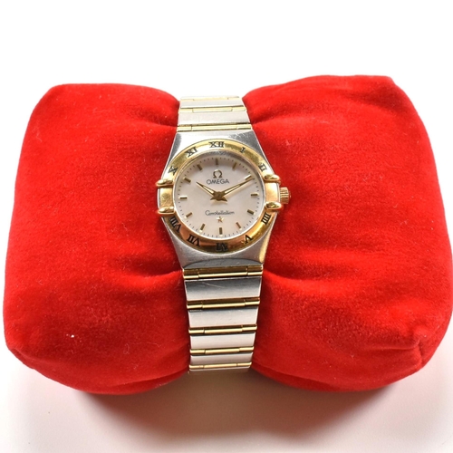 25 - An Omega Constellation ladies wristwatch boxed. The Omega wristwatch having a white mother of pearl ... 