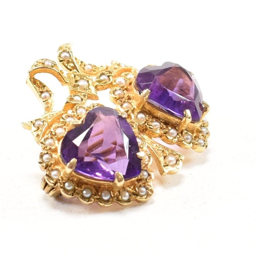 47 - A hallmarked 9ct yellow gold, amethyst and  pearl brooch pin. The antique style twin heart brooch ha... 