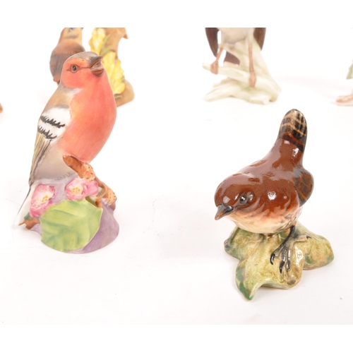 119 - Beswick / Goebel / Royal Worcester - A collection of ten porcelain china figures in the form of bird... 