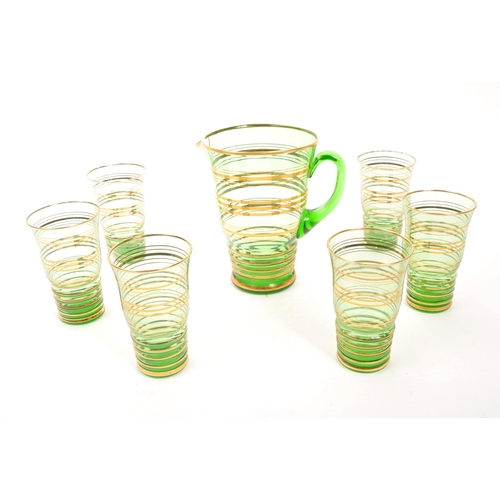 120 - A mid 20th Century retro glass green lemonade set with gold gilt circular ring detailing to body. Co... 