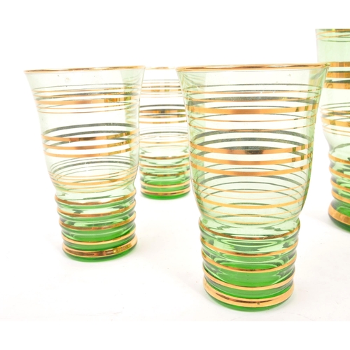 120 - A mid 20th Century retro glass green lemonade set with gold gilt circular ring detailing to body. Co... 