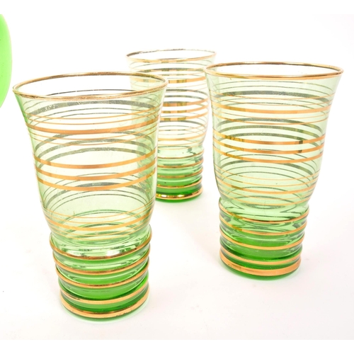 120 - A mid 20th Century retro glass green lemonade set with gold gilt circular ring detailing to body. Co... 