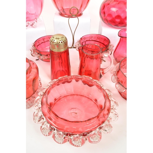 124 - A large collection of mid Century vintage cranberry glassware items to include jugs, bowls, vases, b... 