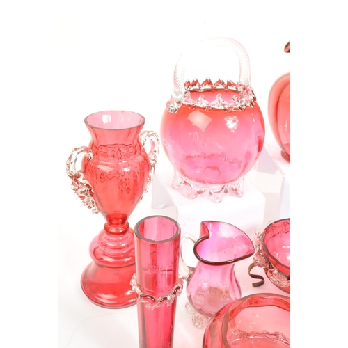 124 - A large collection of mid Century vintage cranberry glassware items to include jugs, bowls, vases, b... 