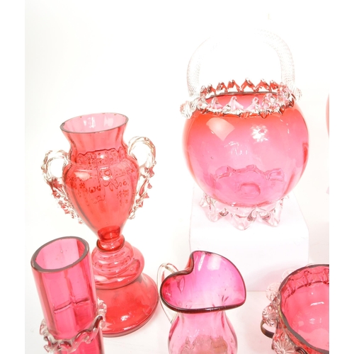 124 - A large collection of mid Century vintage cranberry glassware items to include jugs, bowls, vases, b... 