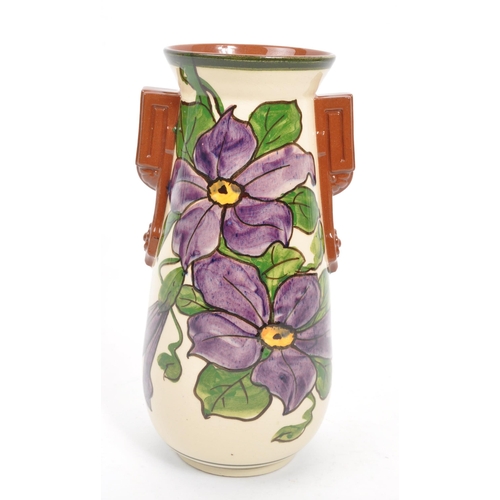 125 - Watcombe Torquay Pottery - A 20th Century circa 1930s ceramic Art Deco faience earthenware vase. The... 