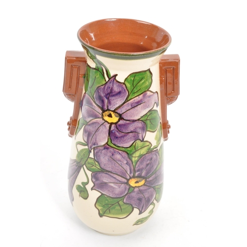 125 - Watcombe Torquay Pottery - A 20th Century circa 1930s ceramic Art Deco faience earthenware vase. The... 